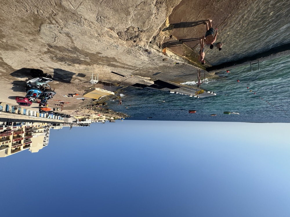 Swimming off the ladders into deep, clear water right in front of Bugibba Square