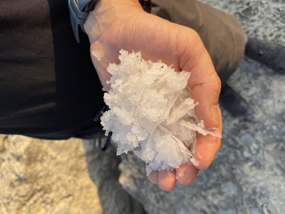 Coarse sea-salt crystals lifted from a rock salt pan at Dwejra, Gozo