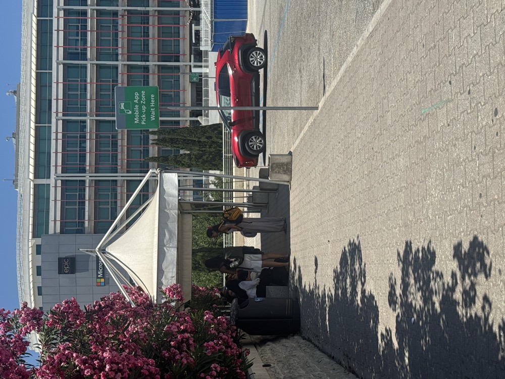 The outdoor car park pickup point at Malta International Airport where Bolt, eCabs and Uber app rides collect passengers, a walk from the arrivals terminal.